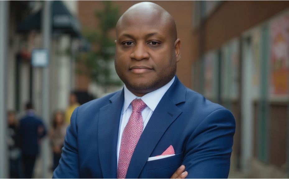 Man in blue suit with pink tie.